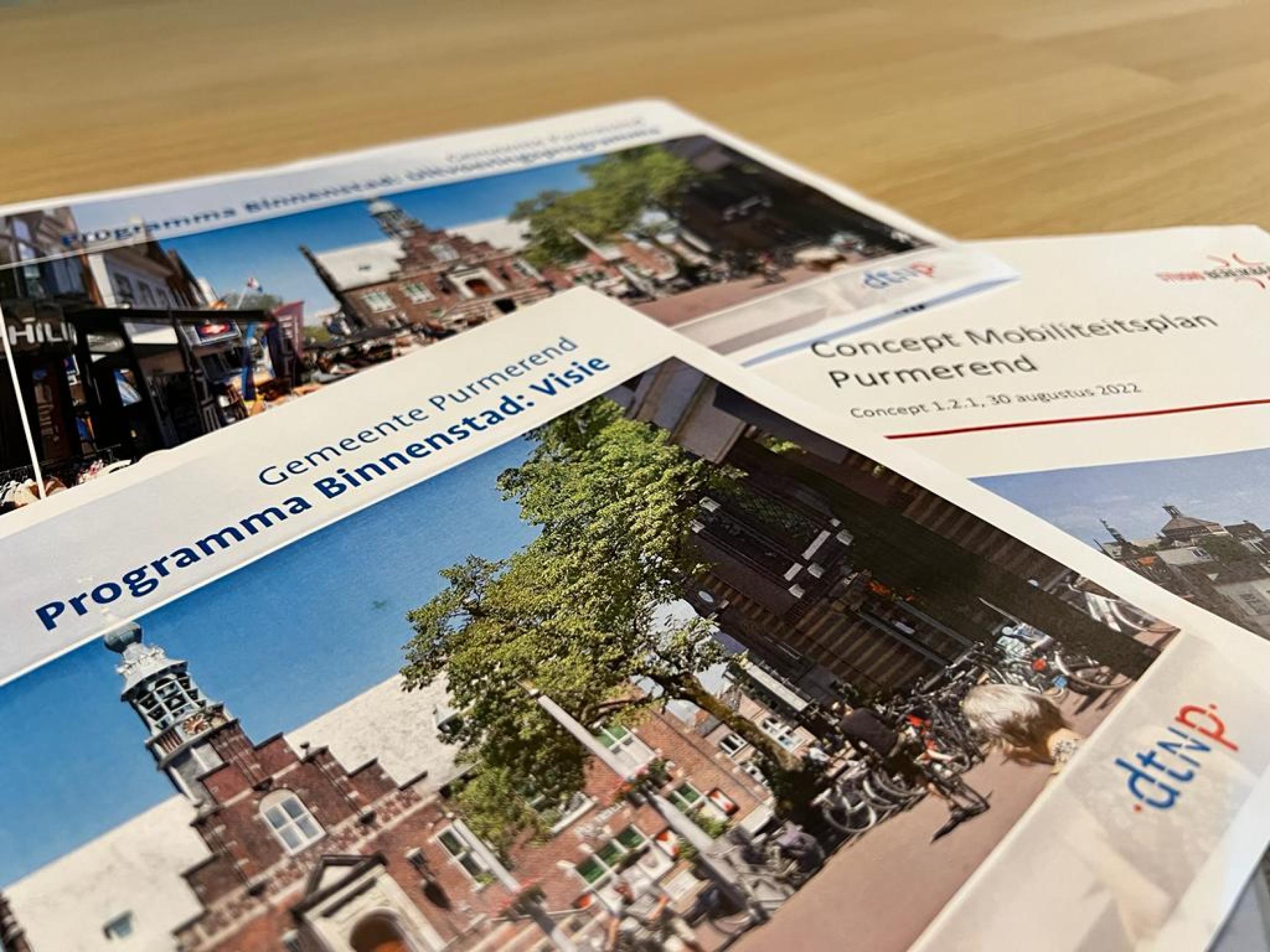 Afbeelding van de voorpagina van de volgende 3 documenten: conceptvisie programma Binnenstad, uitvoeringsprogramma programma binnenstad en concept mobiliteitsplan. 